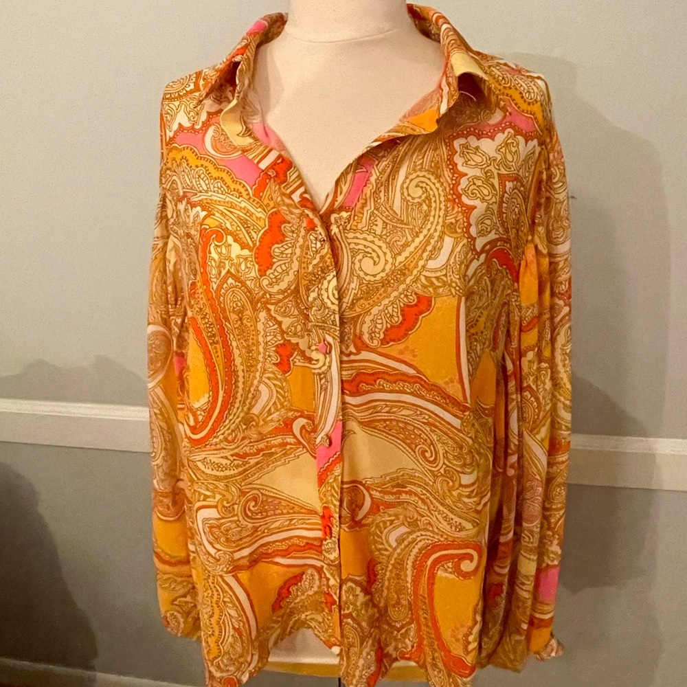 Paisley patterned blouse.